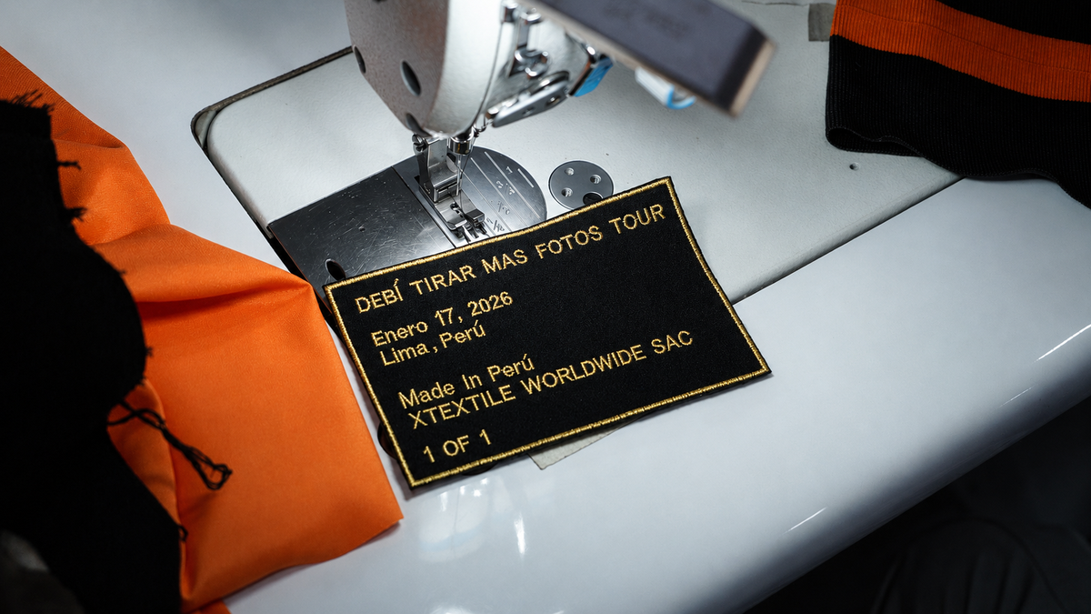 Xtextile workshop preparing the custom label and orange components for the Ñengo Flow jacket