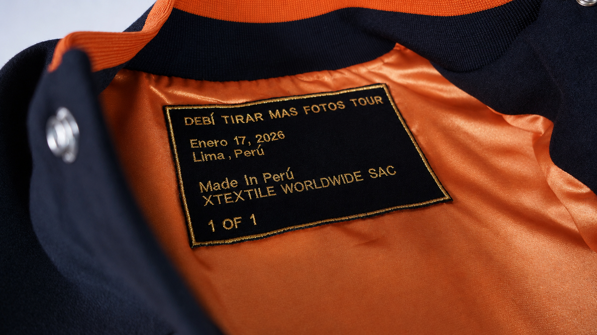 Orange lining, custom knitted collar and one-of-one label inside the Ñengo Flow varsity jacket