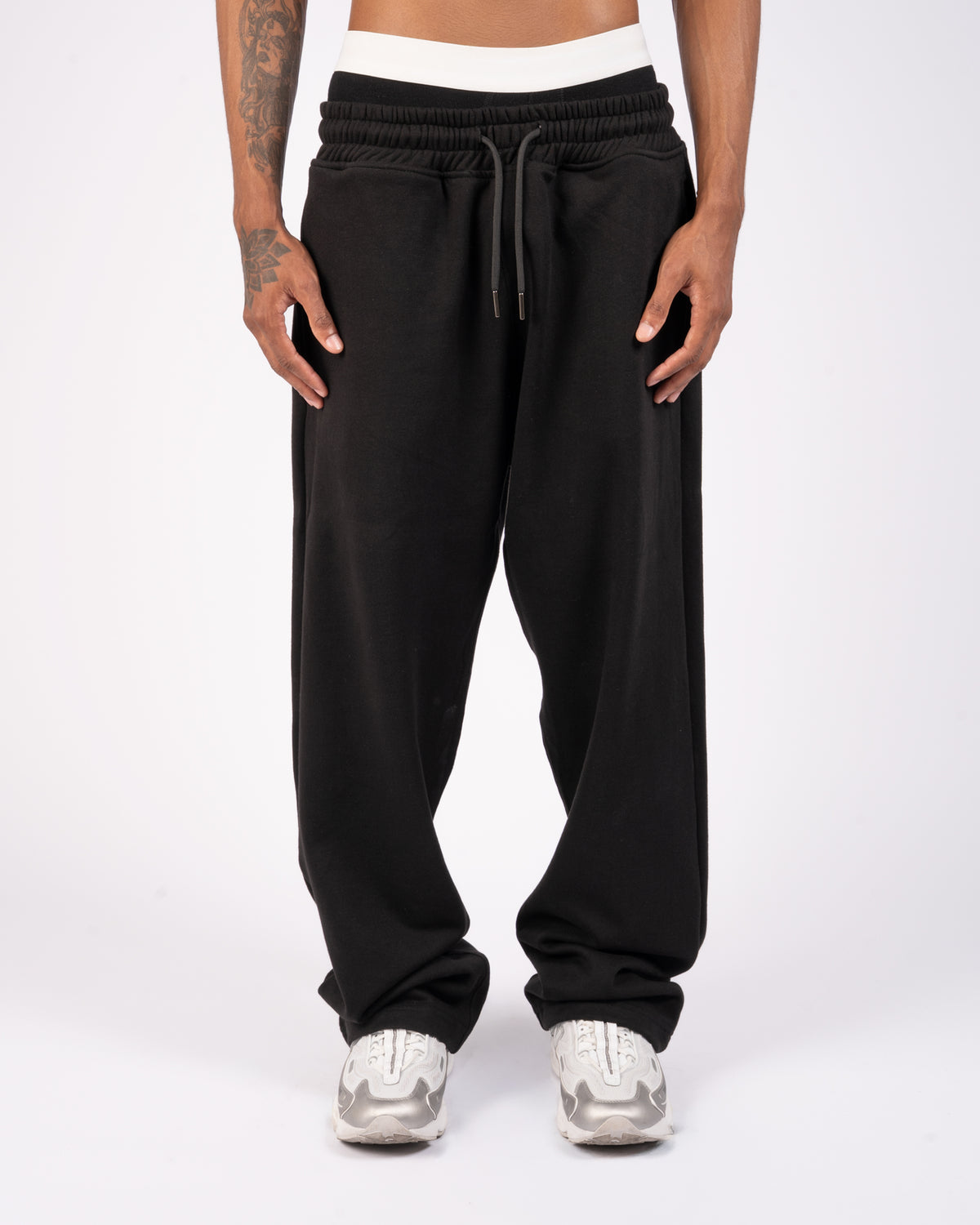 Front view of black relaxed XBLANKS premium sweatpants