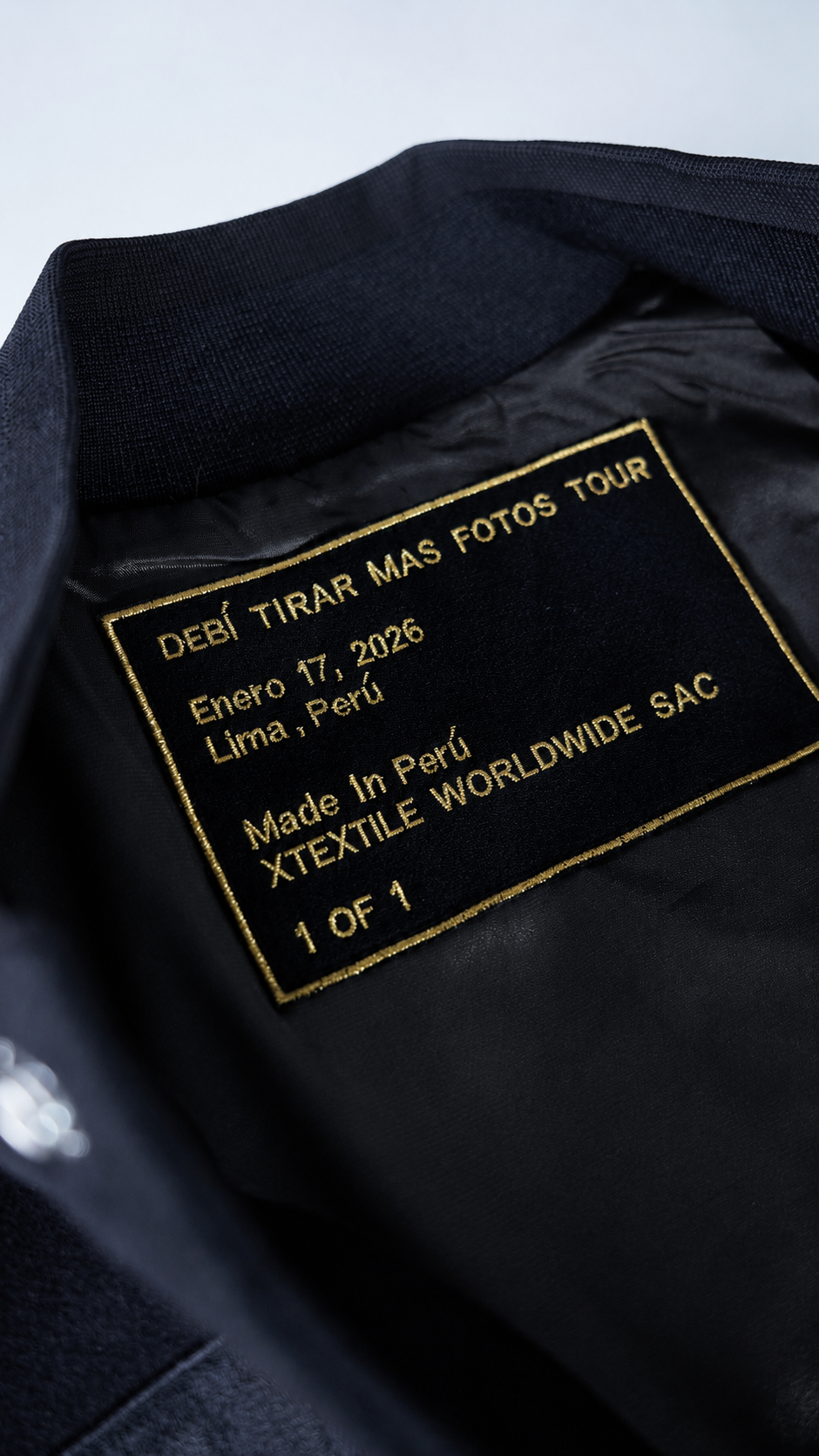 Custom one-of-one Xtextile label inside the Ñengo Flow varsity jacket