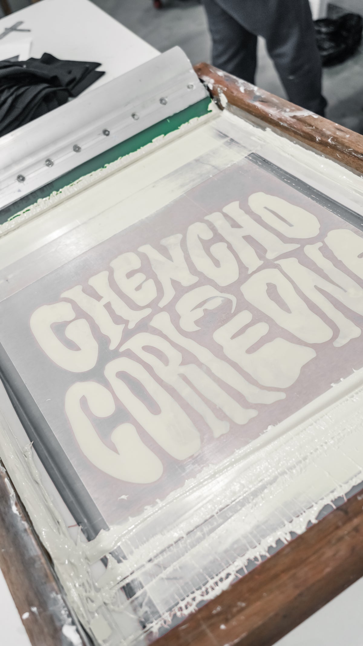 Close-up of the Chencho Corleone graphic during screen printing