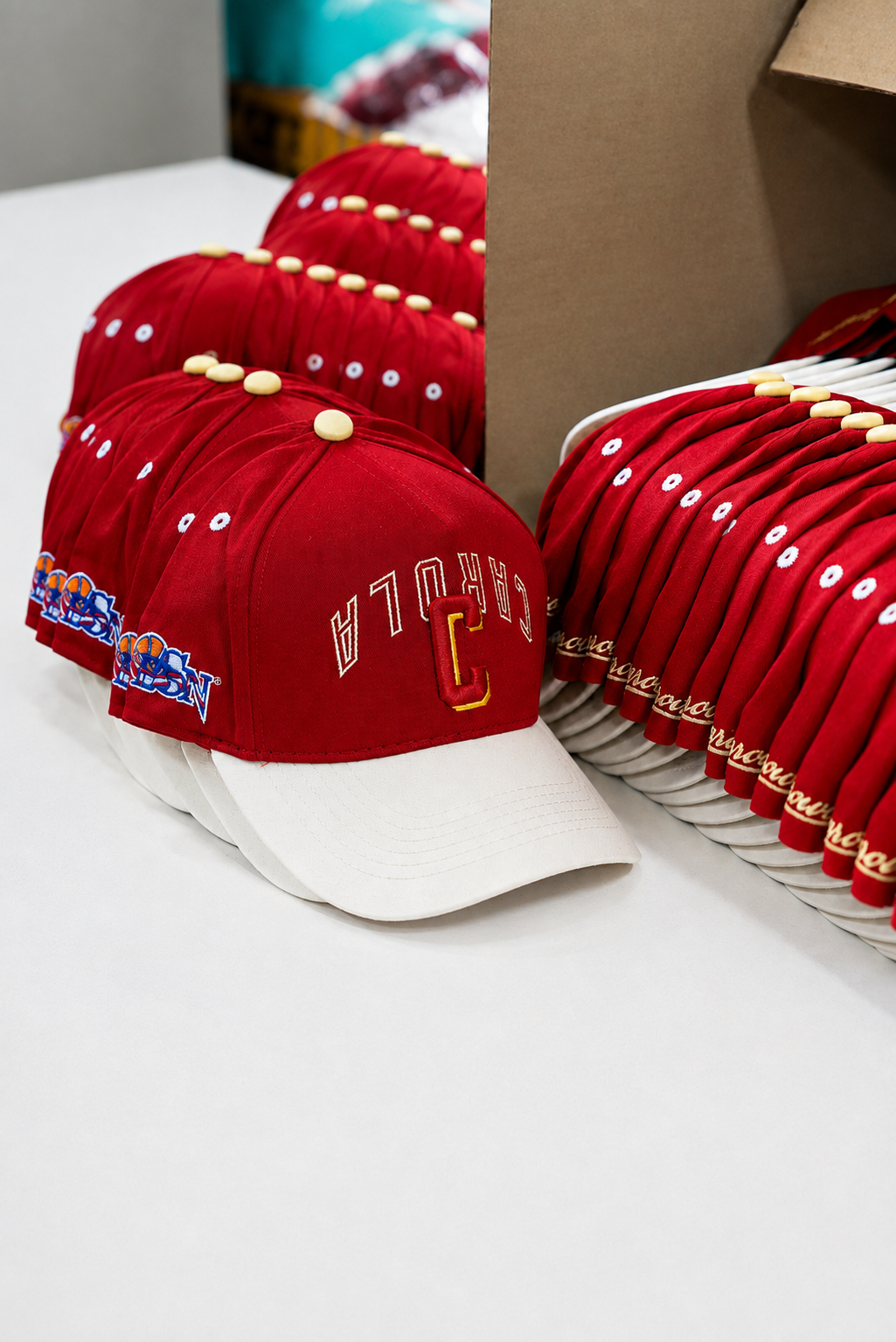 Stacks of red BSN caps organized in a production batch
