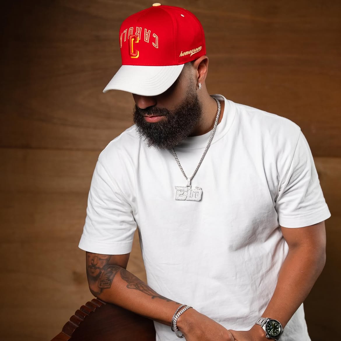 Model wearing a red BSN franchise cap from the official collection